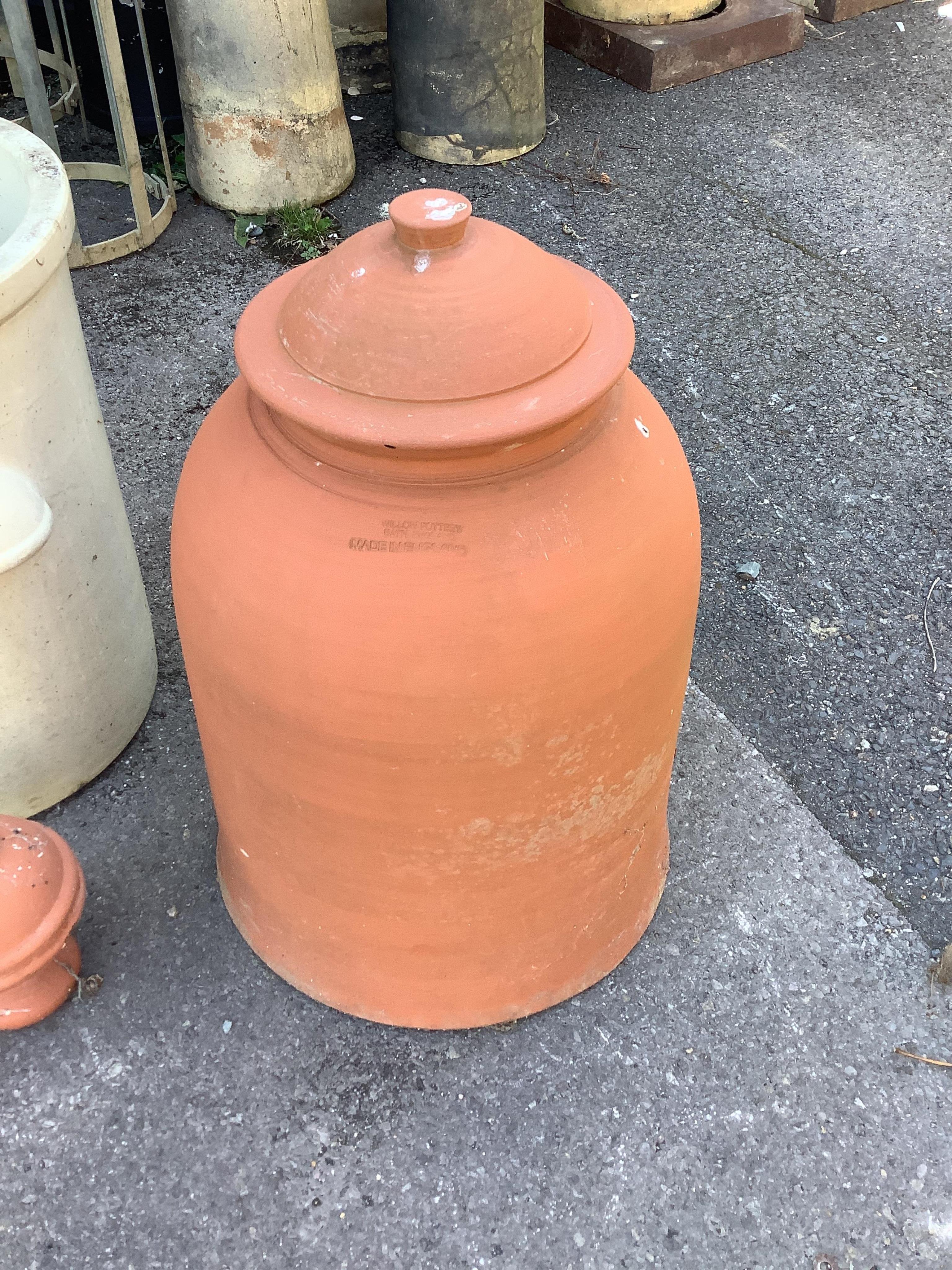 A terracotta rhubarb forcer with lid by Willow pottery, a terracotta finial and a stoneware planter, largest height 60cm. Condition - fair